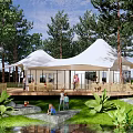 Scenic Camping Site With White Tents Wooden Deck Natural Stream Surrounded By Trees