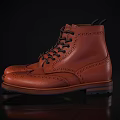 Stylish Orange Leather Brogue Boots With Black Laces And Intricate Patterns