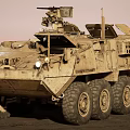 Military Utility Vehicle With Desert Camouflage Multi Wheeled Design Roof Mounted Weapons And Sensors