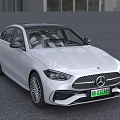White Mercedes Benz Sedan With Sleek Front Design And Alloy Wheels