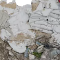 Rubble Pile With Gray Bricks Scattered Small Stones And Blue Green Debris