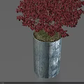 Bonsai Potted Plant with Vibrant Red Leaves in Blue Cylindrical Pot Against Light Blue Background
