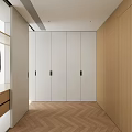 Modern Walk in Closet Interior With White Cabinets Open Hanging Area And Herringbone Wood Floor