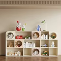 Modern White Bookcase With Round And Square Compartments Holding Books Toys Table Lamp And Decorations