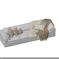 Cozy Light Colored Sectional Sofa with Soft Pillows and Fringed Woven Blankets in Living Room