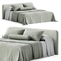 Modern Double Bed With Light Green Textured Bedding Soft Pillows And Upholstered Headboard