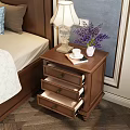 Brown Wooden Nightstand With Fringed Table Lamp Purple Flower Vase And Three Drawers