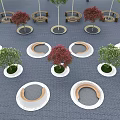 Circular Outdoor Chairs Arranged With Trees On Blue Brick Ground And White Edges