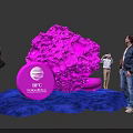 People Interacting With Pink Installation And IBC Amsterdam Logo On Blue Carpet