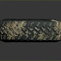 Muddy Off-Road Tire with Deep Tread Pattern and Black Wheel Rim