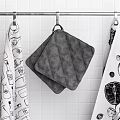 Stylish Bathtub Space With Hanging Gray White Patterned And Dark Towels On White Tiles
