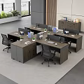 L Shaped Wooden Office Desks In Modern Workspace With Computer Monitors Files And Potted Plants