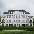 Luxury Detached Villa with Classical Exterior Black Roof and Large Windows Surrounded by Manicured Lawn