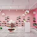 Fashion Store with Pink Walls Multiple Shelves Round Display Tables Hanging Lights and White Cabinets