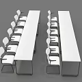 Two Long Conference Tables with White Armrest Chairs and Black Metal Legs
