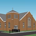 Historic Brick Building Featuring Gabled Roof Arched Windows And Black Fence