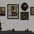 Elegant Wall Arrangement With Various Framed Artworks And Tabletop Decorative Items 3d model