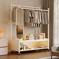 White Clothes Rack With Hanging Clothes Folded Towels Fruits And Mirror On Wheels