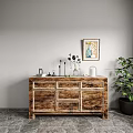Wooden Sideboard With Black Flower Vase Candles Books Framed Art And Potted Plant