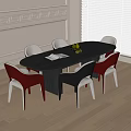 Oval Black Dining Table With Red White Black Chairs White Wall And Wooden Floor
