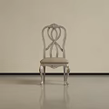 Elegant Silver Dining Chair With Carved Backrest Upholstered Seat And Curved Legs