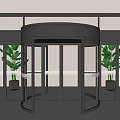 Black Frame Transparent Glass Revolving Door In Indoor Environment With Plants And Gray Floor Tiles