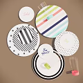 Colorful Dinnerware Set With Striped Polka Dot Plates And Clear Glasses For Table Setting