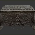 Ornate Metal Clothing Storage Box With Intricate Carvings And Decorative Feet
