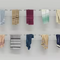 Colorful Towels Hanging on Metal Rods with Various Patterns and Soft Textures for Bathroom Decor