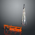 Scale Rocket Model Display With Orange Launch Pad And Structural Details