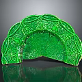 Green Sculpture Carving Featuring Fan Shaped Design With Intricate Leaf Patterns And Glossy Texture