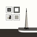 Four Modern Abstract Paintings With Black Frames On White Wall Near Floor Lamp