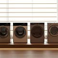 Four Modern Washing Machines Placed By Window With Wooden Countertop And Soft Lighting
