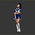 Young Woman In Blue And White Cheerleader Uniform Posing Against Gray Background