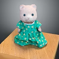 Cute Stuffed Bear Doll Wearing Green Dress With Yellow Star Patterns On Wooden Platform
