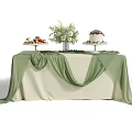 Decorated Table with Beige and Green Tablecloth Fruit Platter Cake and Floral Arrangement