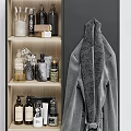 Soft Rolled Towels On Wooden Shelf With Cozy Bathrobe And Bathroom Accessories