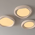 Three Modern Oval Shaped Ceiling Lights with White Frames and Illuminated Glow 3d model