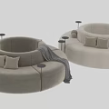 Curved Sectional Sofa In Beige And Gray With Pillows Side Tables And Throw Blanket
