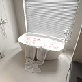 Modern Bathroom Interior Featuring White Bathtub With Flower Petals And Towel