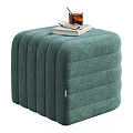 Beige Striped Ottoman With Book Glass Of Drink And Eyeglasses For Living Room Decor
