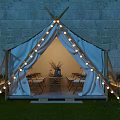 Garden Landscape With Canvas Tent String Lights Stone Wall Table And Chairs