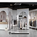 Modern Clothing Store Interior With Arched Doorways Clothing Racks And Mirrors