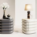 Modern Gray And White Stacked Nightstands With Table Lamp Vase Flowers Books And Small Bowl