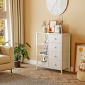 White Storage Shelf with Drawers in Living Room Decorated with Vases Frames and Candles