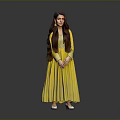 A Woman in Yellow Flowy Dress with Long Hair and Earrings Standing Against Gray Background