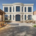 Detached Villa With White Exterior Large Windows Porch Outdoor Pavilion Stone Patio And Landscaped Garden