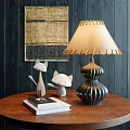 Elegant Table Lamp On Wooden Table With Cat Figurines Books And Dark Wooden Wall Art