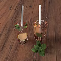 Refreshing Drinks on Wooden Table with Ice Lemon Slices Mint Leaves and Straws