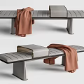 Modern Gray Striped Ottoman With Brown Throw Blanket And Metal Legs
